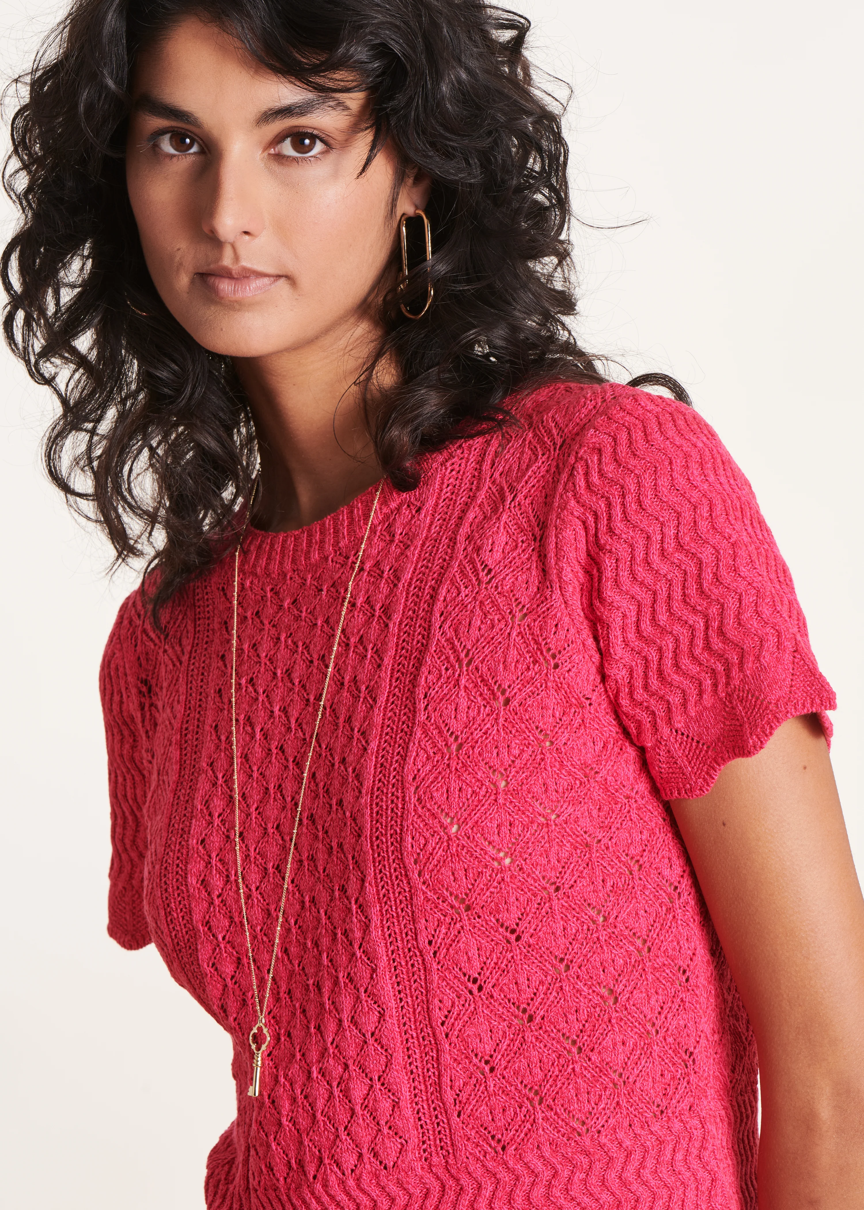Pull rose fuchsia à manches courtes et col rond